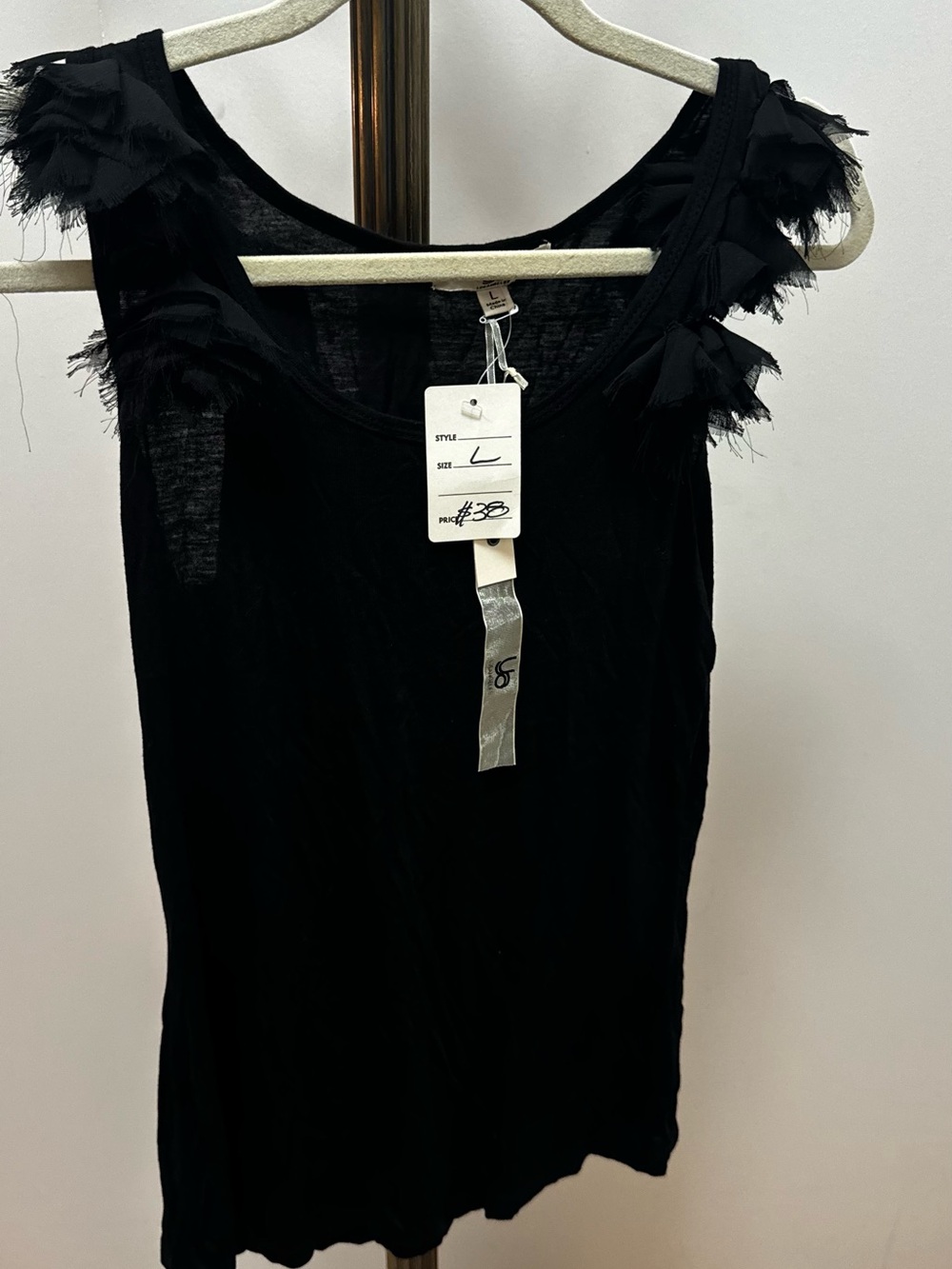 Los Angeles Sleeveless Black Tank with Ruffle Shoulder Detail